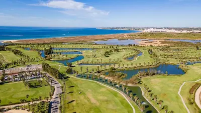 an aerial view of a park with trees and water at Filomena Golf Paradise in Guia