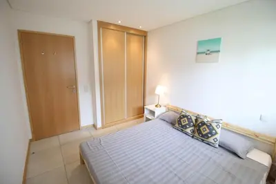 a bedroom with a large bed in a room at 2 Bed apartment with Roof Top Pool, close to Falesia Beach AT10 in Albufeira