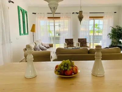 a bowl of fruit on a table in a living room at Villa Med - private pool, garden, sun all day, stunning views in Albufeira