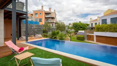 a swimming pool in the backyard of a house at Apartment Luisa in Vale do Lobo