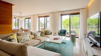 a living room with a couch and a tv at Apartment Luisa in Vale do Lobo