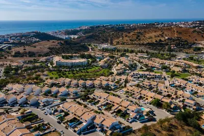an aerial view of a residential suburb with the ocean at Sunny 2BDR House W/ Private Pool by LovelyStay in Albufeira