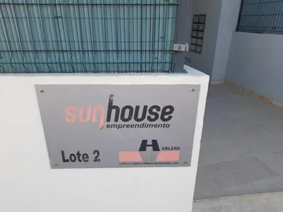a sign for a sun house on the side of a building at Mshomes II in Albufeira