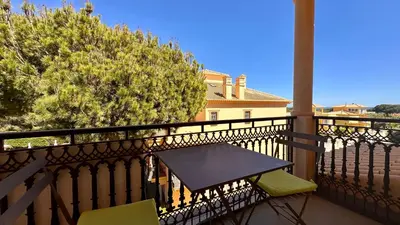 a table and two chairs on a balcony at Bicos 303 by Check-in Portugal in Albufeira