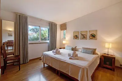 a bedroom with a bed and a window at Casa Las Trinitarias in Vale do Lobo
