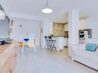 a living room with a white couch and a table at AL - Apartamento Sunrise, Sol Nascente 1 Ground floor in Vilamoura