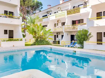 a swimming pool in front of a building at AL - Apartamento Sunrise, Sol Nascente 1 Ground floor in Vilamoura