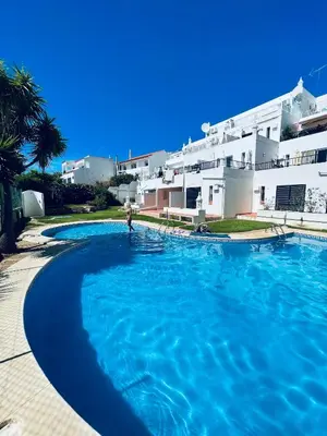a large swimming pool in front of a building at Ocean View Skyline Apartment ‚Hakuna Matata‘ in Albufeira