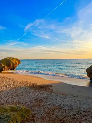 a view of a beach with rocks and the ocean at Ocean View Skyline Apartment ‚Hakuna Matata‘ in Albufeira
