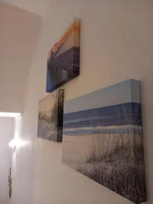 a painting of the beach on a wall at Sunset View Apartment - 22 in Albufeira