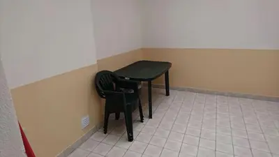 a small table and two chairs in a room at Faro City Center Apartment I in Faro