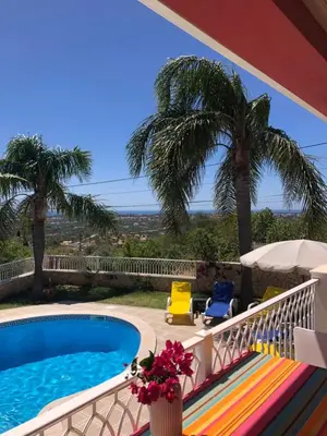 a group of chairs and a swimming pool at CASA PANORAMICA VUE MER 8 a 10 Personnes in Boliqueime