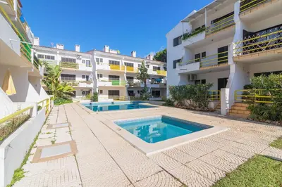 an apartment with two swimming pools in a building at Vilamoura Premium Apartment With Pool by Homing in Vilamoura