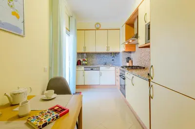 a bedroom with a bed and a desk and a window at BnB Homes Ocean view Apartment with huge sunny Terrace, 2 Swimming pools & Tennis court in Albufeira