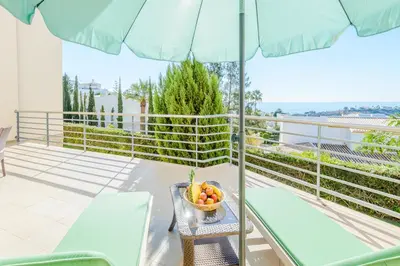 an overhead view of a building with a pool at BnB Homes Ocean view Apartment with huge sunny Terrace, 2 Swimming pools & Tennis court in Albufeira