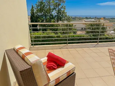a swimming pool in front of a building at BnB Homes Ocean view Apartment with huge sunny Terrace, 2 Swimming pools & Tennis court in Albufeira