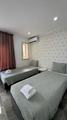 a bedroom with two beds and a window at The Strip Oura apartment in Albufeira