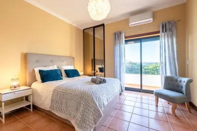 a view of a beach with people on a cliff at #071 Maria Luisa by Home Holidays in Albufeira