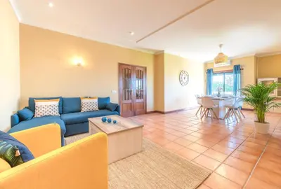 a beach with chairs and umbrellas on the sand at #071 Maria Luisa by Home Holidays in Albufeira