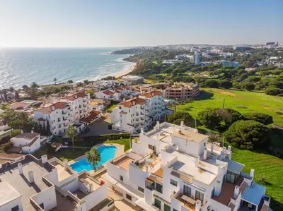a view of a building with an orange circle on it at #071 Maria Luisa by Home Holidays in Albufeira