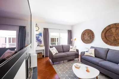a living room with a couch and a table at Villa Paradisius by Algarve Vacation in Albufeira