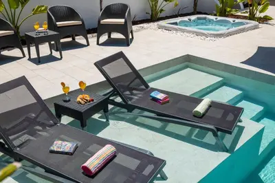an overhead view of a patio with chairs and a pool at Villa Paradisius by Algarve Vacation in Albufeira