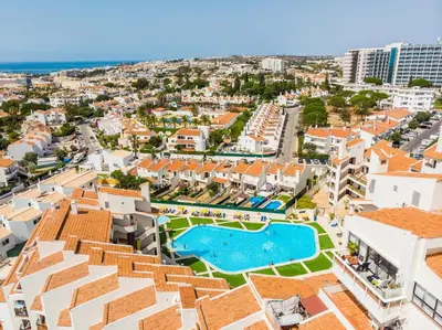 a living room with a view of the ocean at #065 Zulmira Flat by Home Holidays in Albufeira