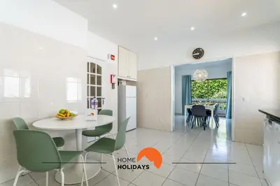 a kitchen and dining room with a table and chairs at #072 Casa Longa by Home Holidays in Albufeira