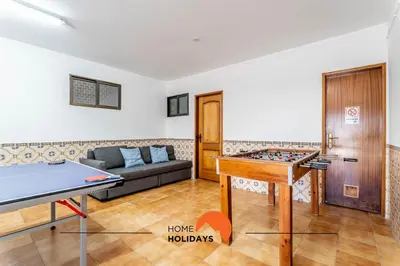 a living room with a ping pong table and a couch at #072 Casa Longa by Home Holidays in Albufeira