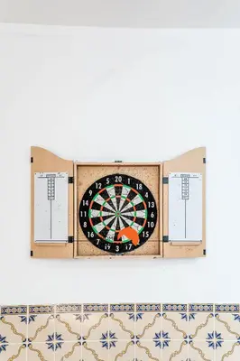 a dart board on a wall with tiles at #072 Casa Longa by Home Holidays in Albufeira