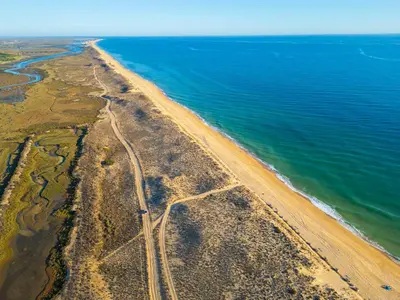 an aerial view of a road next to the ocean at Villa Dalia by Algarve Vacation in Almancil