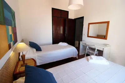 a hotel room with two beds and a mirror at Charming Villa by SAPvillas in Vilamoura