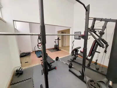 an empty room with a gym with a treadmill at Marina Mar Light by SAPvillas in Vilamoura