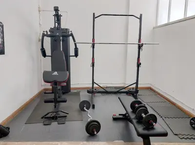 a room with a gym with weights and a chair at Marina Mar Sea Breeze by SAPvillas in Vilamoura