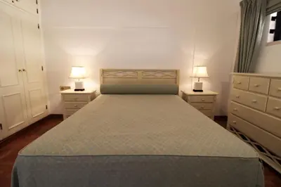 a bedroom with a bed with two night stands and two lamps at Marina Mar Navigator by SAPvillas in Vilamoura
