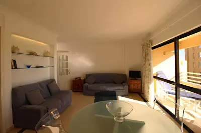 a living room with a couch and a table at Marina Mar Navigator by SAPvillas in Vilamoura