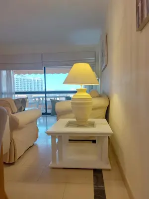 a lamp on a table in a living room at Marina Mar Sailor by SAPvillas in Vilamoura