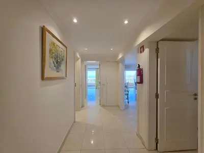 a living room with a couch and a table and chairs at Marina Mar Ocean View by SAPvillas in Vilamoura