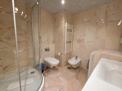 a bedroom with two beds and a door to a hallway at Marina Mar Ocean View by SAPvillas in Vilamoura