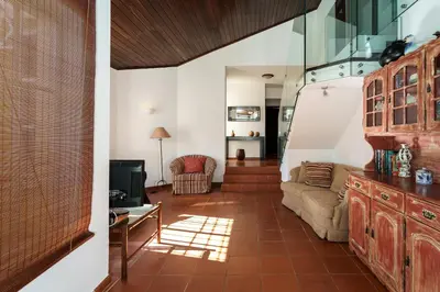 a living room with a couch and a table at Villa Mianas by SAPvillas in Vilamoura