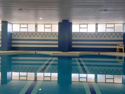 an empty swimming pool in a building at Marina Mar Marina by SAPvillas in Vilamoura