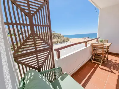 a balcony with a view of the beach at #070 T0 Edifício Albufeira by Home Holidays in Albufeira