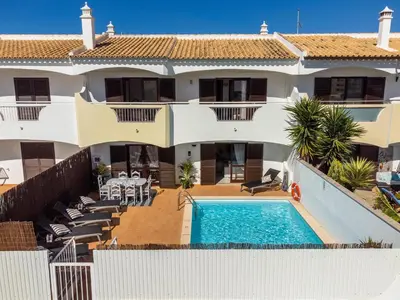an aerial view of a house with a swimming pool at Villa Canto II - 500m from the Beach - Private Swimming Pool - Wi Fi in Guia