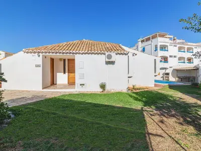 a white house with a yard and a building at Villa Villa Genoveva by Interhome in Albufeira