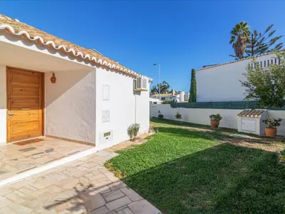 a villa with a yard and a house at Villa Villa Genoveva by Interhome in Albufeira