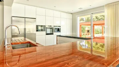 a kitchen with white cabinets and a black counter top at Dream Villa with Luxury Services - PROMOTION Last dates! in Vilamoura