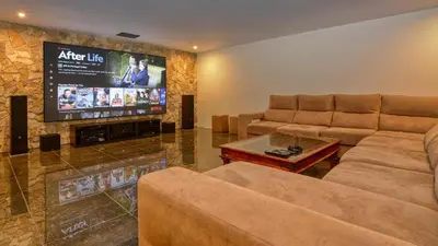 a living room with couches and a flat screen tv at Dream Villa with Luxury Services - PROMOTION Last dates! in Vilamoura