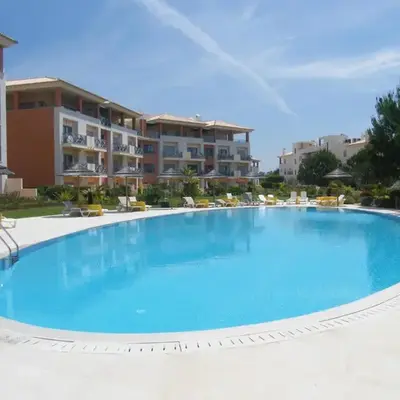 Luxurious first floor apartment with balconies overlooking pool and gardens.