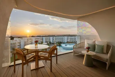a living room with a couch and a table at W Algarve in Albufeira