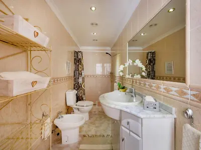 a bathroom with a sink and a toilet and a sink at Holiday Home Isaurinda by Interhome in Faro